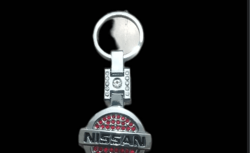 جا سویچی خودرو نگین دار استیل اعلا طرح nissan