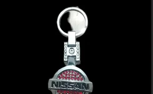 جا سویچی خودرو نگین دار استیل اعلا طرح nissan